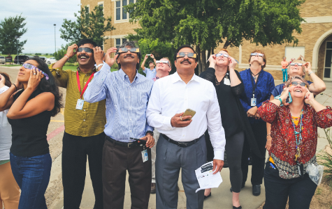 Faculty and staff viewing the eclipse.