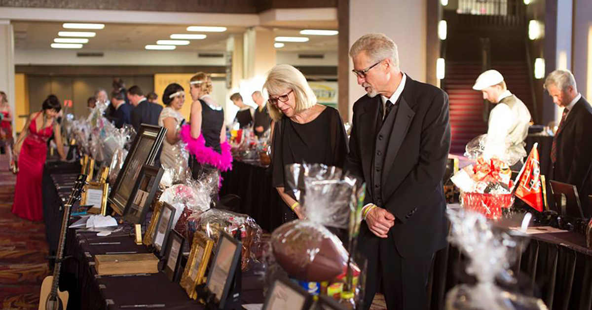 Patrons visit items during auction