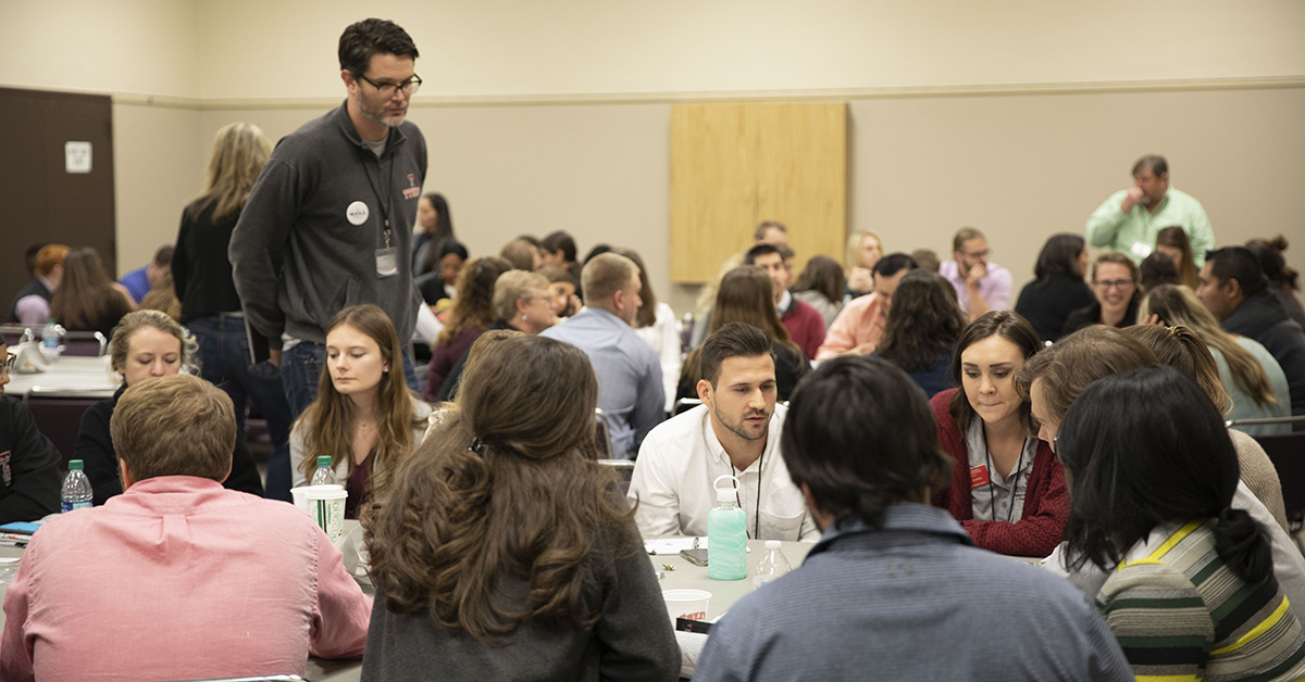 Students from each school learn together at the Interprofessional Education Symposium.