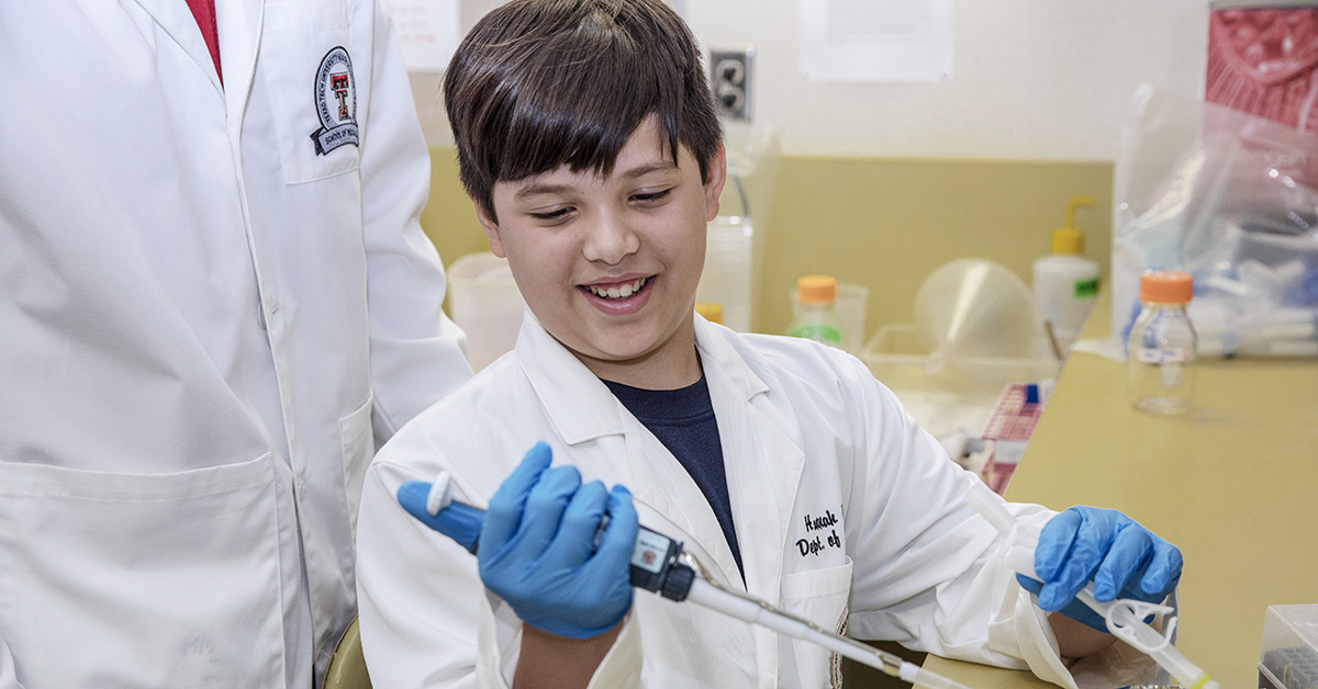 Seventh grader uses lab equipment