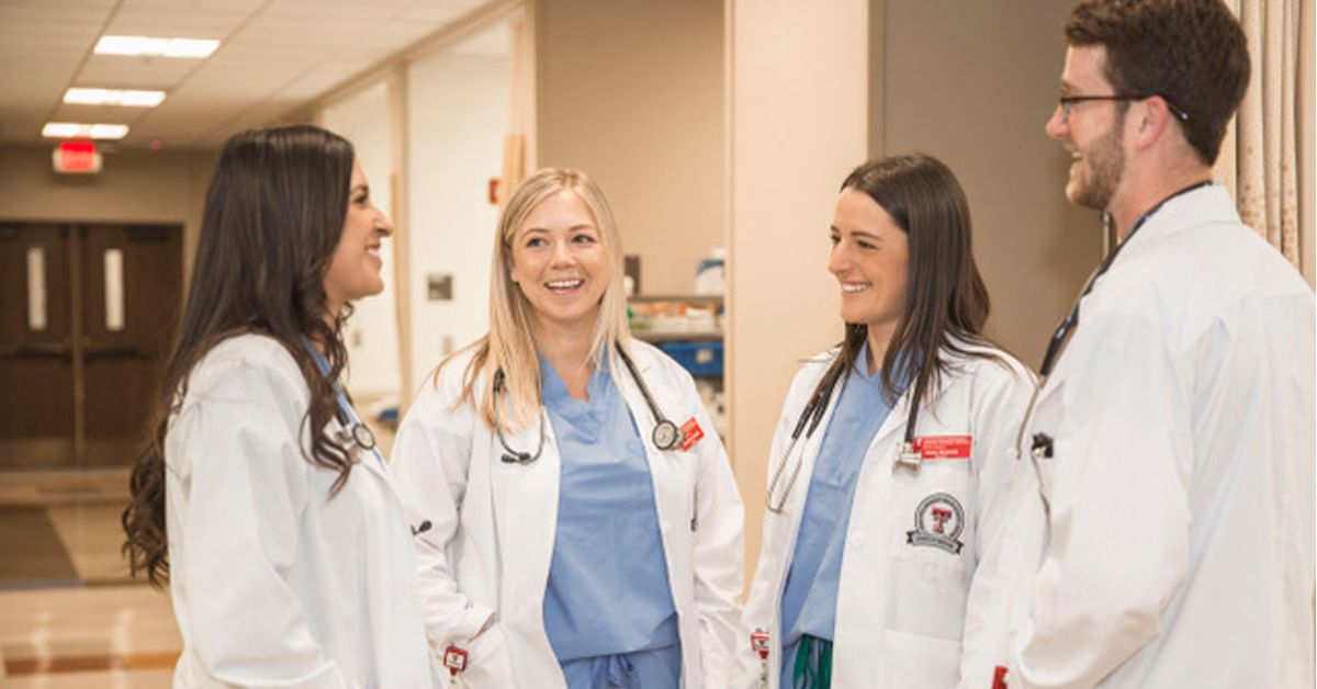 ttuhsc student in lab coats in discussions