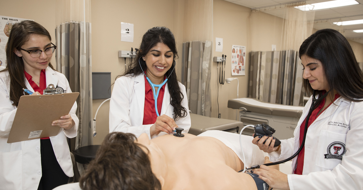 TTUHSC physician assistant students assessing a patient.