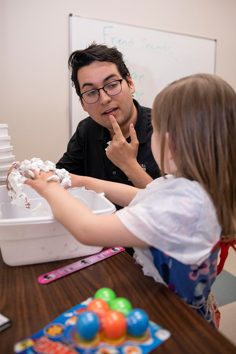 Speech, Language and Hearing Specialist working with a patient.