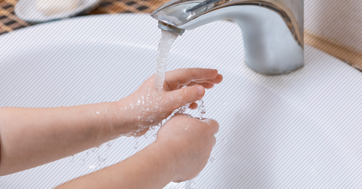 child washing hands