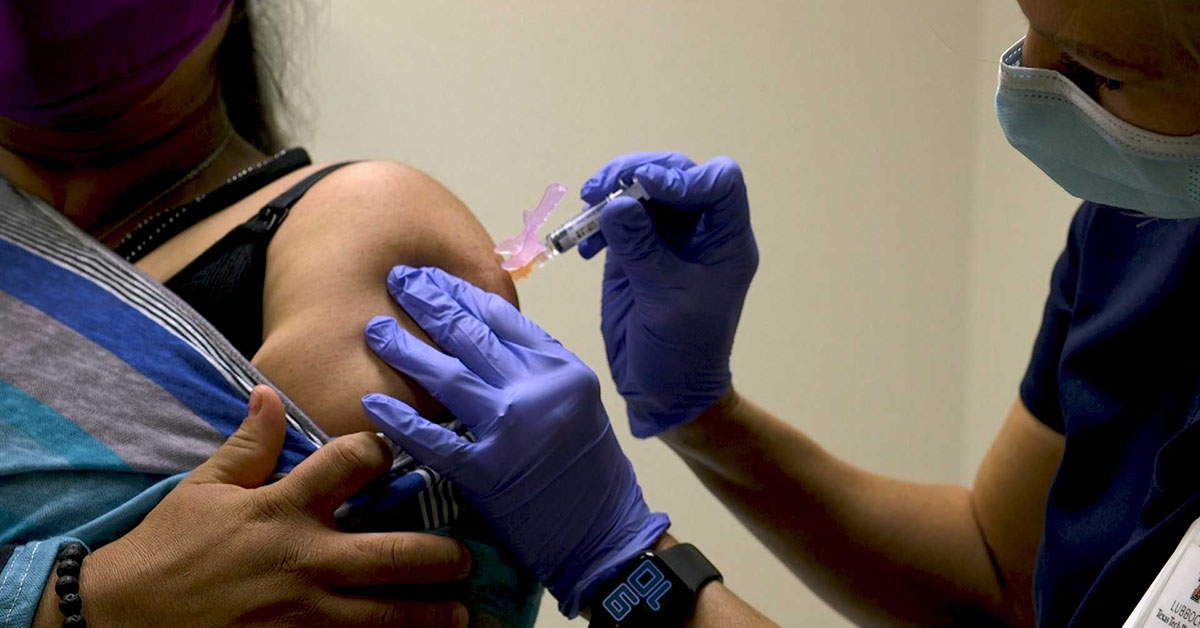 woman getting flu shot 