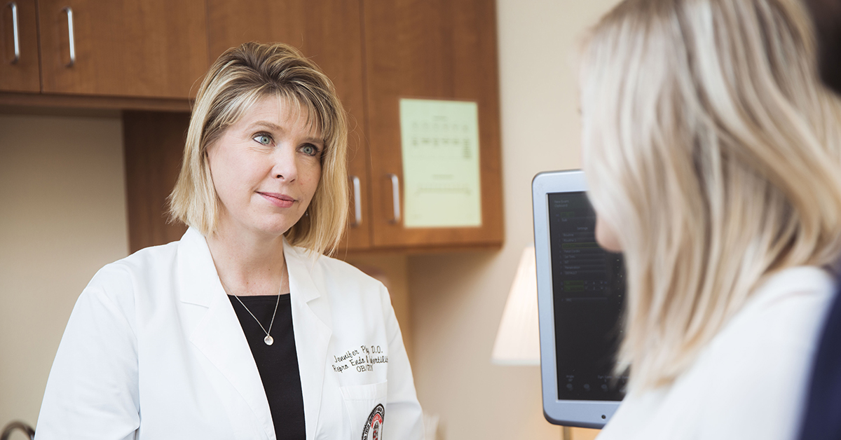 Jennifer Phy, D.O., talking to a patient