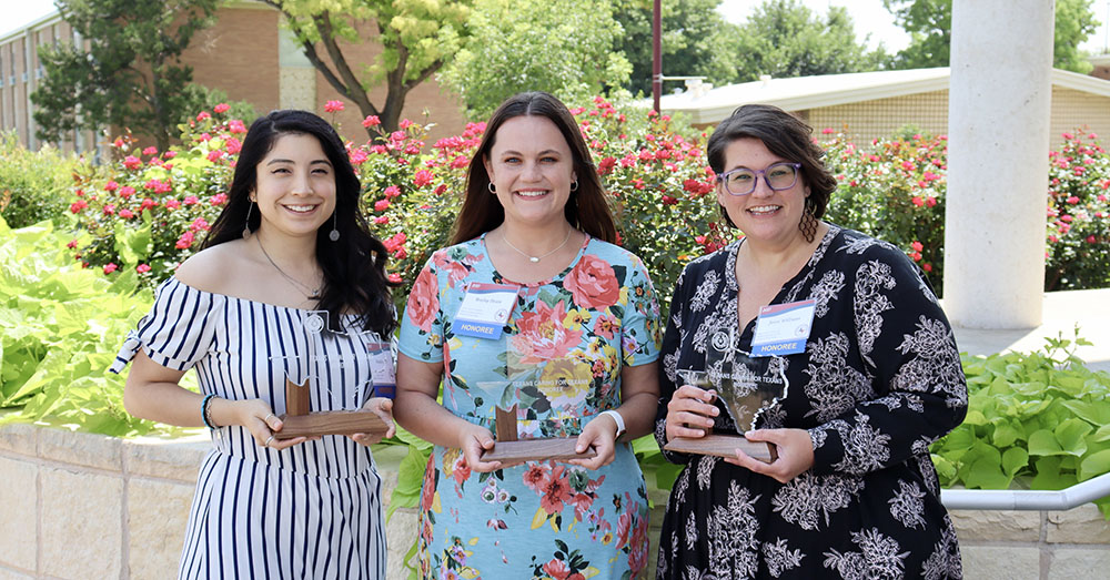 Texas Tech Physicians Pediatric Hematology-Oncology team holding awards and smiling