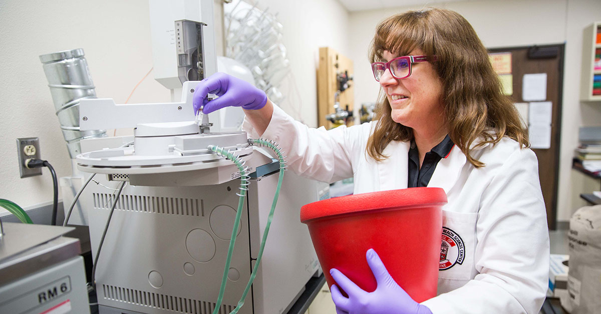 Susan Bergeson, PhD, working in a lab