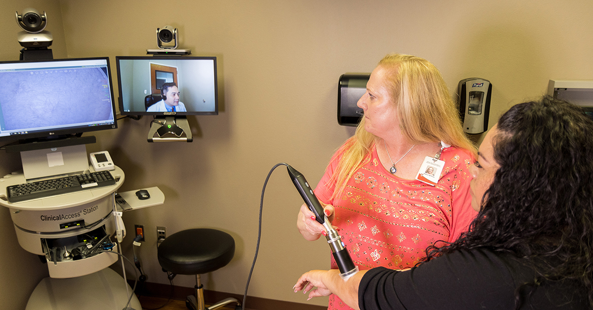 patient interacts with doctor Ariel Santos, M.D., through telehealth resources on a screen