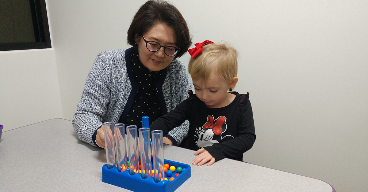 Dr. Lee with a young patient