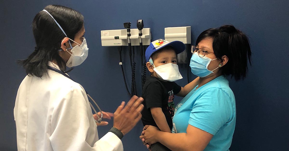 Logan and his mother with their oncologist