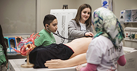 child learning during "docs for a day" event