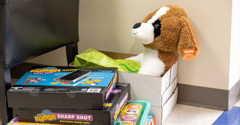 stuffed animal in a box and board games