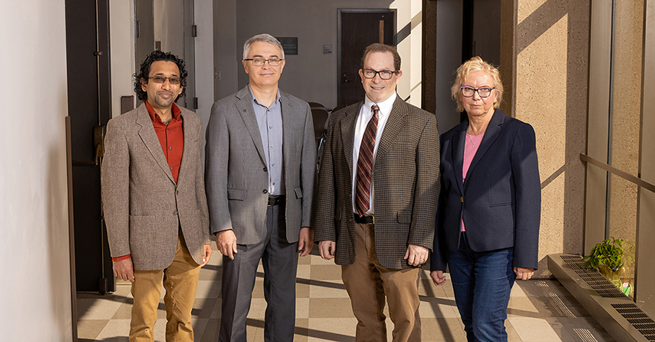 John Lawrence, PhD with his team of researchers