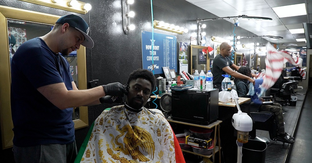 Students and clients at local Lubbock barbershop discuss health topics