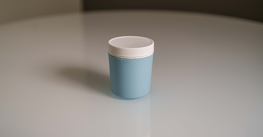 cup on table, known as Device for Improved Semen Collection, or DISC