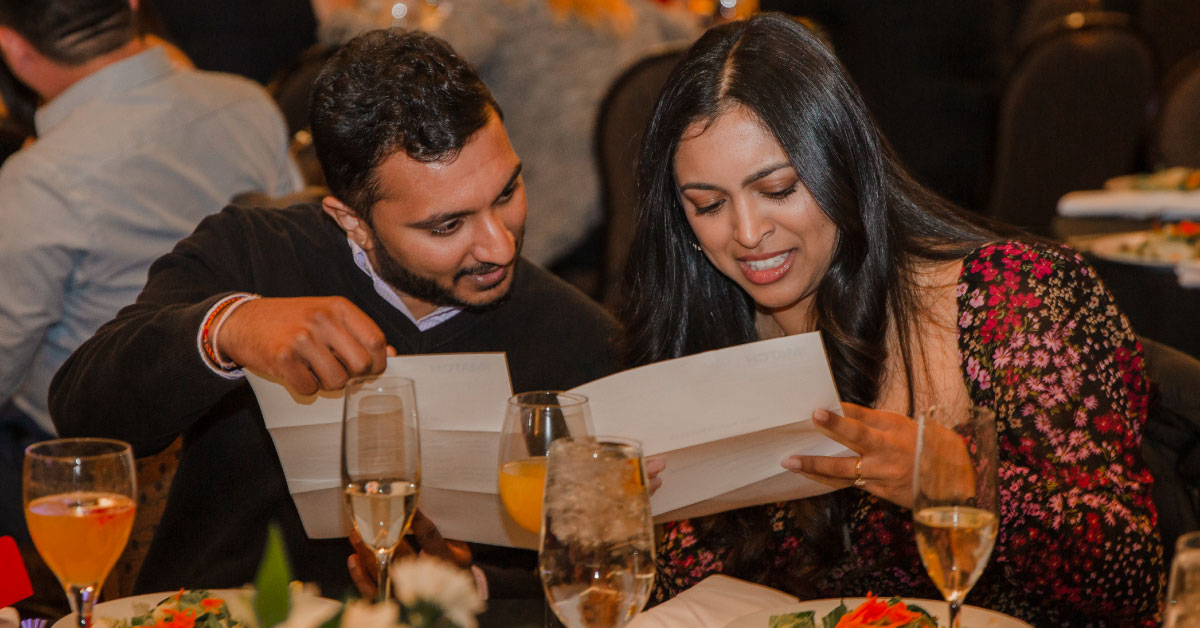 One male and one female TTUHSC medical student open envelopes to learn where they've matched for residency.