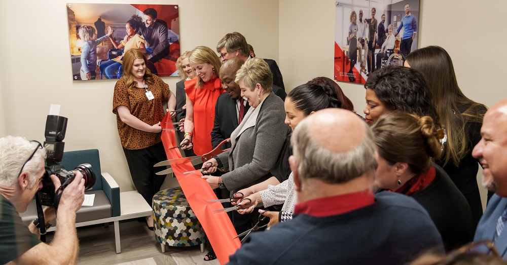 President Lori Rice-Spearman and others cutting the ribbon for the Wellness Clinic opening