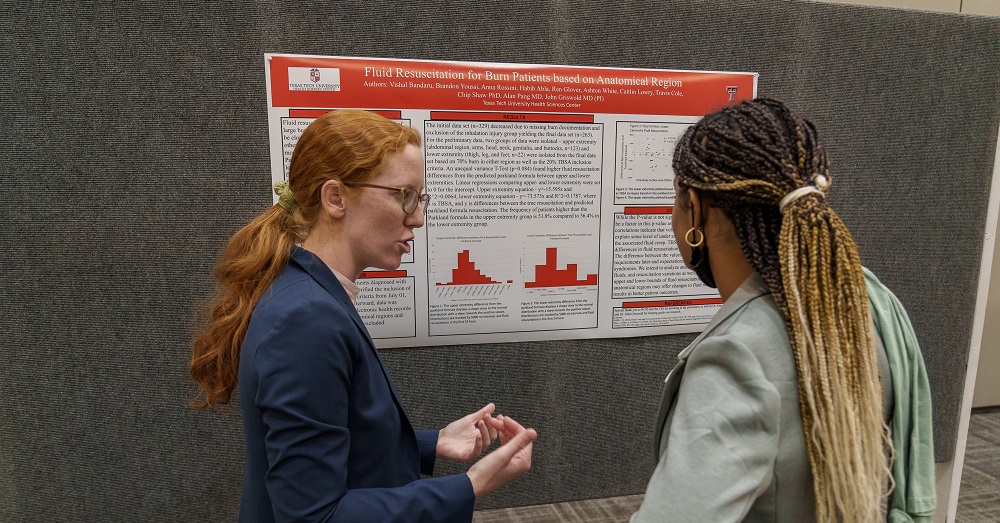 student providing information during poster presentations at SRW 2023