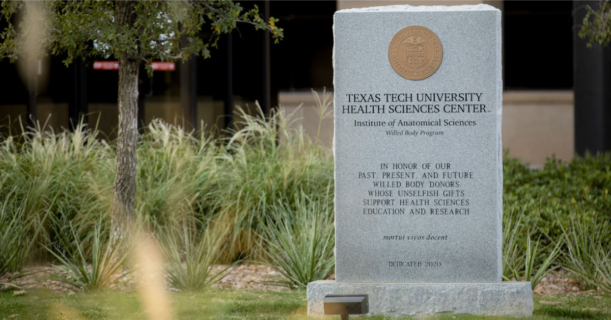 Willed Body Program plaque siting in a garden.