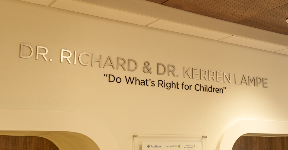 wall of the new Covenant Relational Health Center which reads "Do what's right for children" and the names of Drs. Richard and Kerren Lampe
