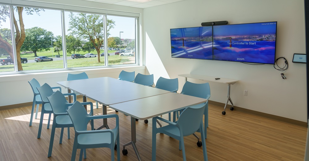 table and chairs with a winow-view at the new relational health center