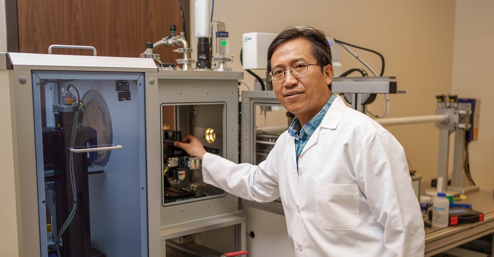 Hongjun (Henry) Liang, Ph.D. working in a lab