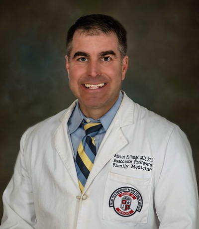 Headshot of Adrian Billings, M.D., Ph.D. in his white coat with the TTUHSC logo on it