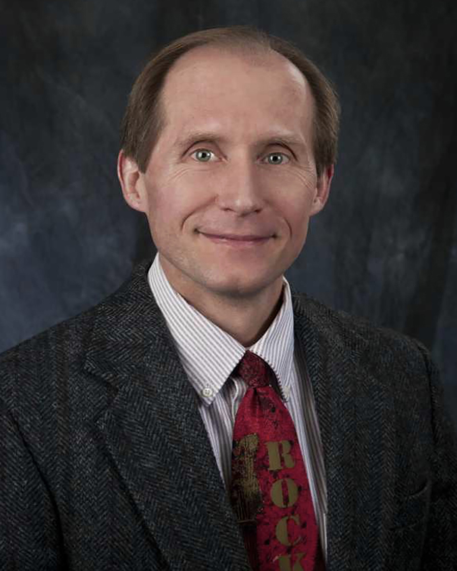 Male TTUHSC regional dean wears a suit and tie.