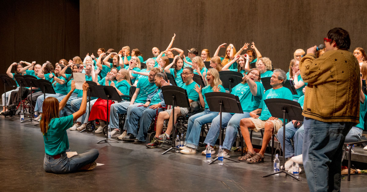 Aphasia patients perform a concert on stage.