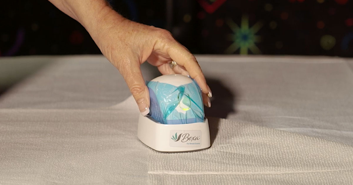 Hand holding a Bexa device.