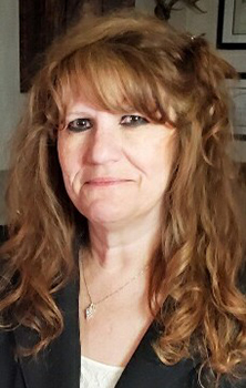 Woman nursing dean's headshot