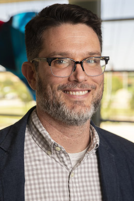 Male TTUHSC professor smiles.