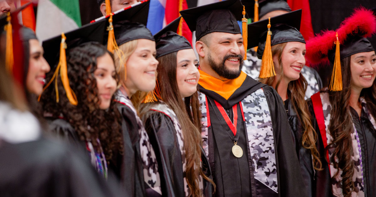 Several TTUHSC VBSN graduates stand together at commencement.