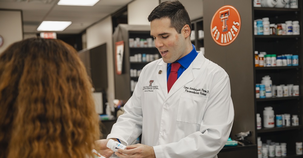 pharmacy professional talking to a patient