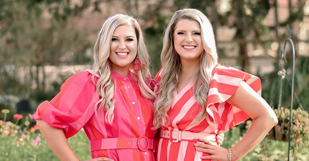 two women smiling side by side