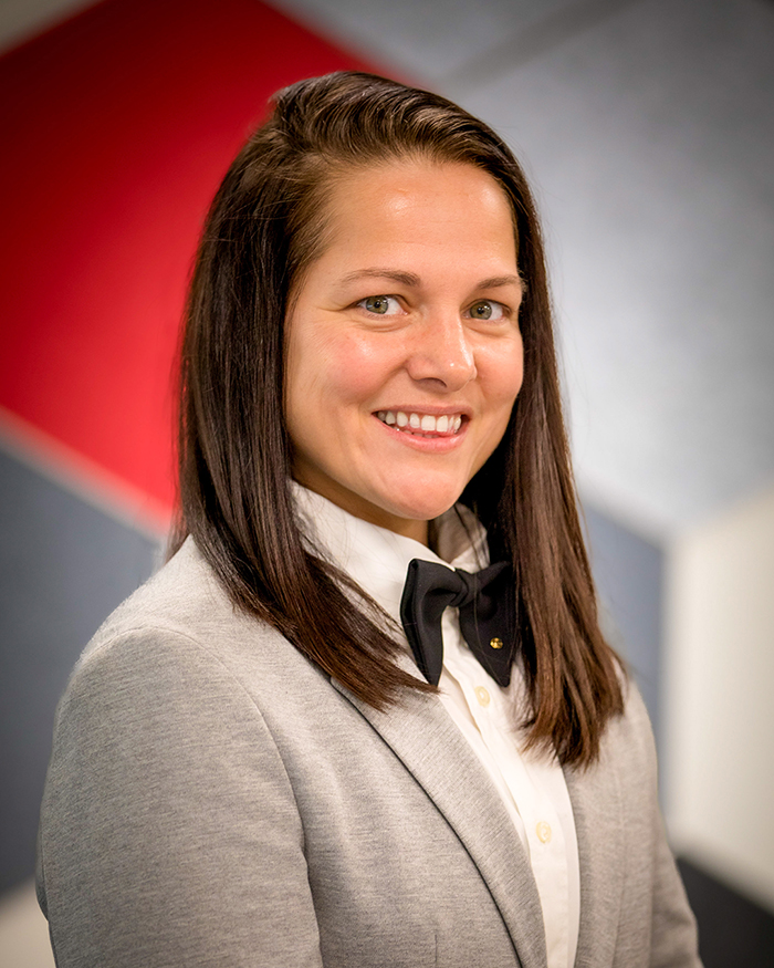 Andjelka Pavlovic wears a grey jacket and black bowtie.