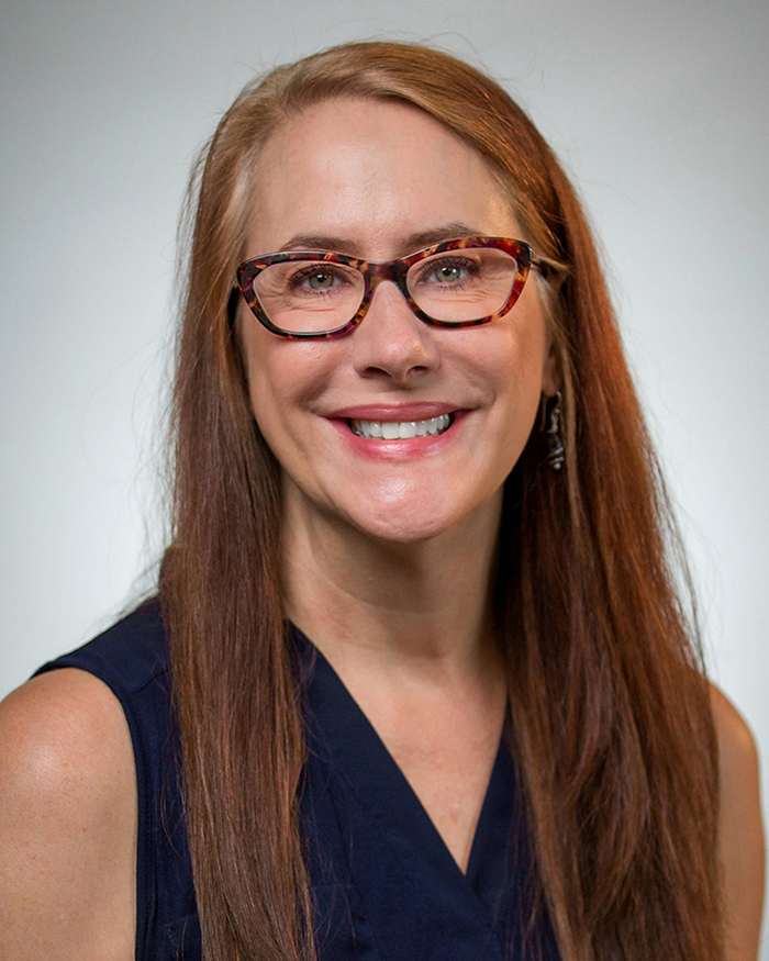 Kendra P. Rumbaugh wears eyeglasses.