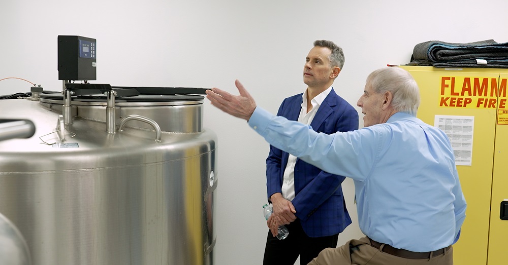 two men look at a research facility