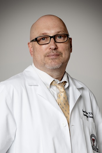 Thomas E. Hutson, D.O., Pharm.D., Ph.D.,