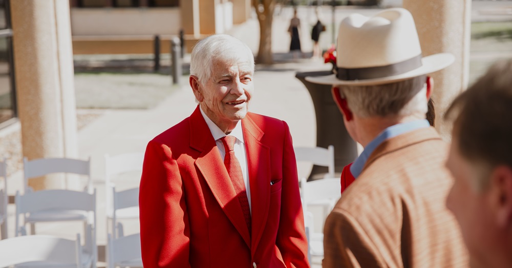 Tom Craddick speaking with another man at the naming ceremony for the Nadine and Tom Craddick Physician Assistant Studies Program