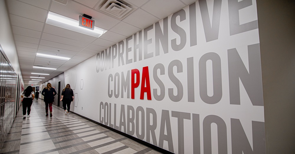 wall in a midland building that reads "comprehensive compassion and collaboration"
