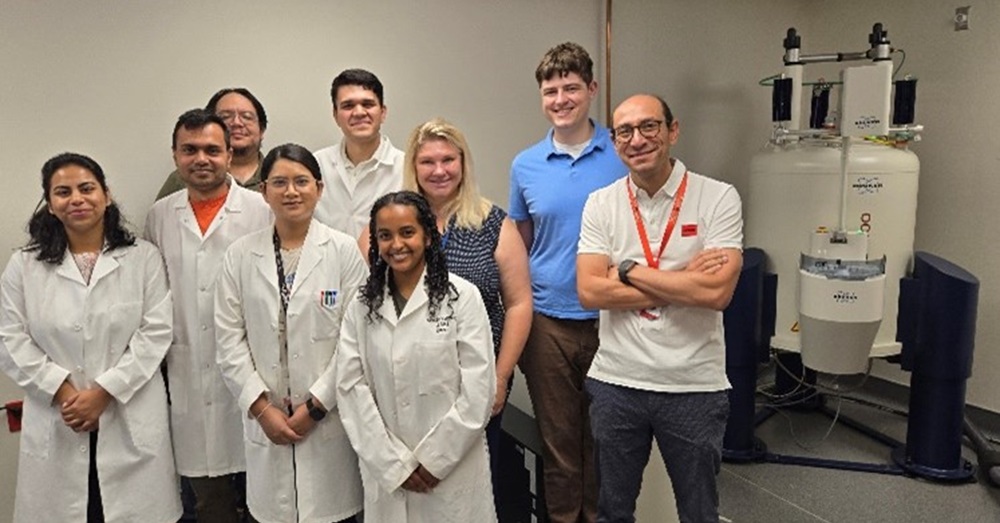  Nuclear Magnetic Resonance core with group of students