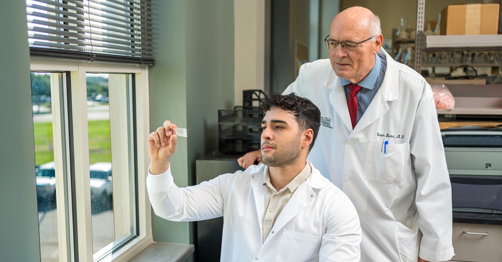two doctors in white coats in a lab