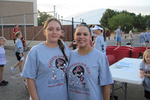 Jo Ann S. Perez (right), with the Department of Orthopaedics, suffered a seizure after the birth of her twins. With her is Sharen Muniz, an employee in the Surgery/ENT Clinic.